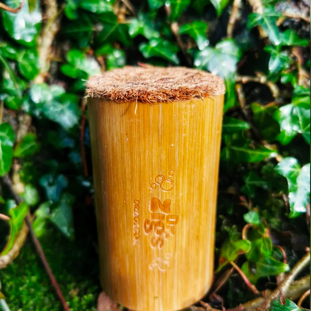 Close up of the Dr Zigs bamboo bubble foamer tube in some green ivy leaves