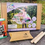 Dr Zigs eco-friendly giant bubble want flatpack kit laid out on a piece of slate in front of some green grass
