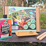 Dr Zigs eco-friendly multi wand bubble kit laid out on a piece of slate on some grass