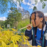 Child using the straw from the Dr Zigs bubble pollinator kit