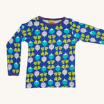 A light blue Duns long sleeve top with a light blue and light purple radish design on a cream background