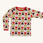 A light pink Duns long sleeve top with a red and brown radish design on a cream background