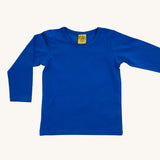 A blue Duns long sleeve top on a cream background.