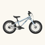 Side of a Early Rider belter 14 inch kids bicycle showing a arctic blue top half and brushed aluminium bottom half frame