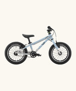 Side of a Early Rider belter 14 inch kids bicycle showing a arctic blue top half and brushed aluminium bottom half frame