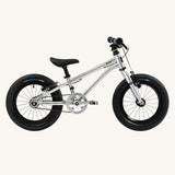 Side profile view of the The Early Rider Belter 14" Kids Pedal Bike for 3-5 Years in brushed aluminium. Babipur are official stockists of Early Rider. 