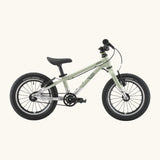 Side of a Early Rider belter 14 inch kids bicycle showing a sage green top half and brushed aluminium bottom half frame