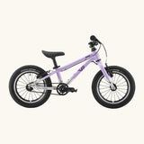 Side of a Early Rider belter 14 inch kids bicycle showing a violet haze top half and brushed aluminium bottom half frame