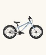Side of a Early Rider belter 16 inch kids bicycle showing a arctic blue top half and brushed aluminium bottom half frame