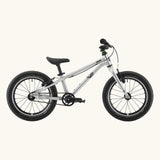 Side of a Early Rider belter 16 inch kids bicycle showing brushed aluminium bottom half frame, belt drive chain and chunky wheels