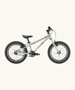 Side of a Early Rider belter 16 inch kids bicycle showing a sage green top half and brushed aluminium bottom half frame