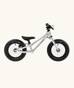 Early Rider charger balance bike with brakes in brushed aluminium.
