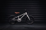 Early rider kids 14 inch belter bicycle in a dark workshop