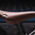 Close up of the brown seat on the Early Rider childrens charger balance bike