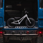 Early rider childrens 12 inch balance bike in the back of a blue 4x4 truck