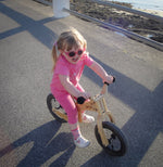little girl riding an Early Rider Lite Balance Bike