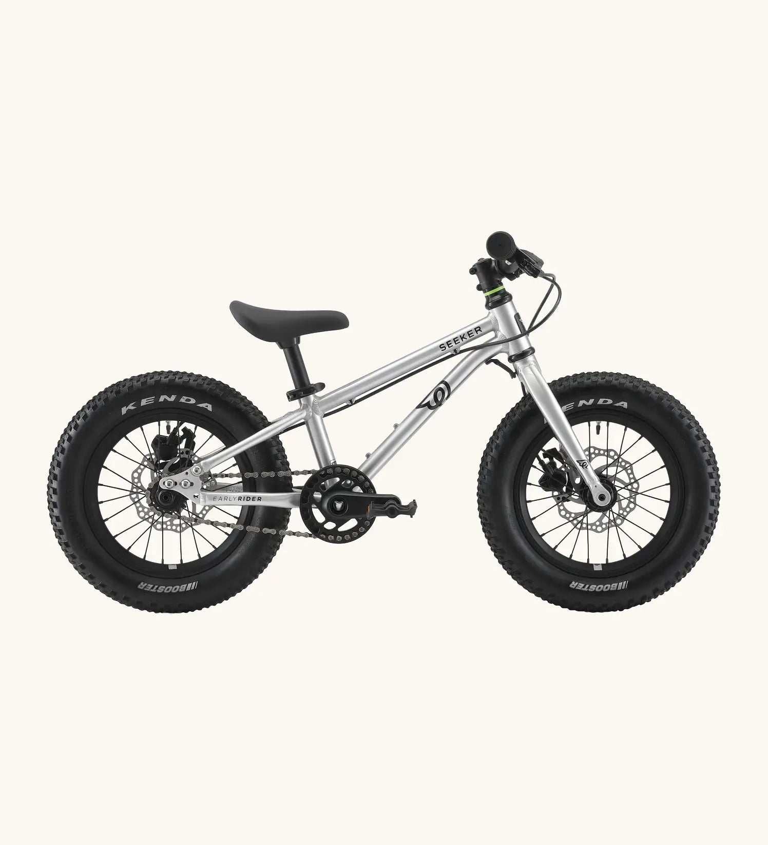 Side of Early Rider kids Seeker 14 inch mountain bike in brushed alloy. Features disk brakes and chunky wheels