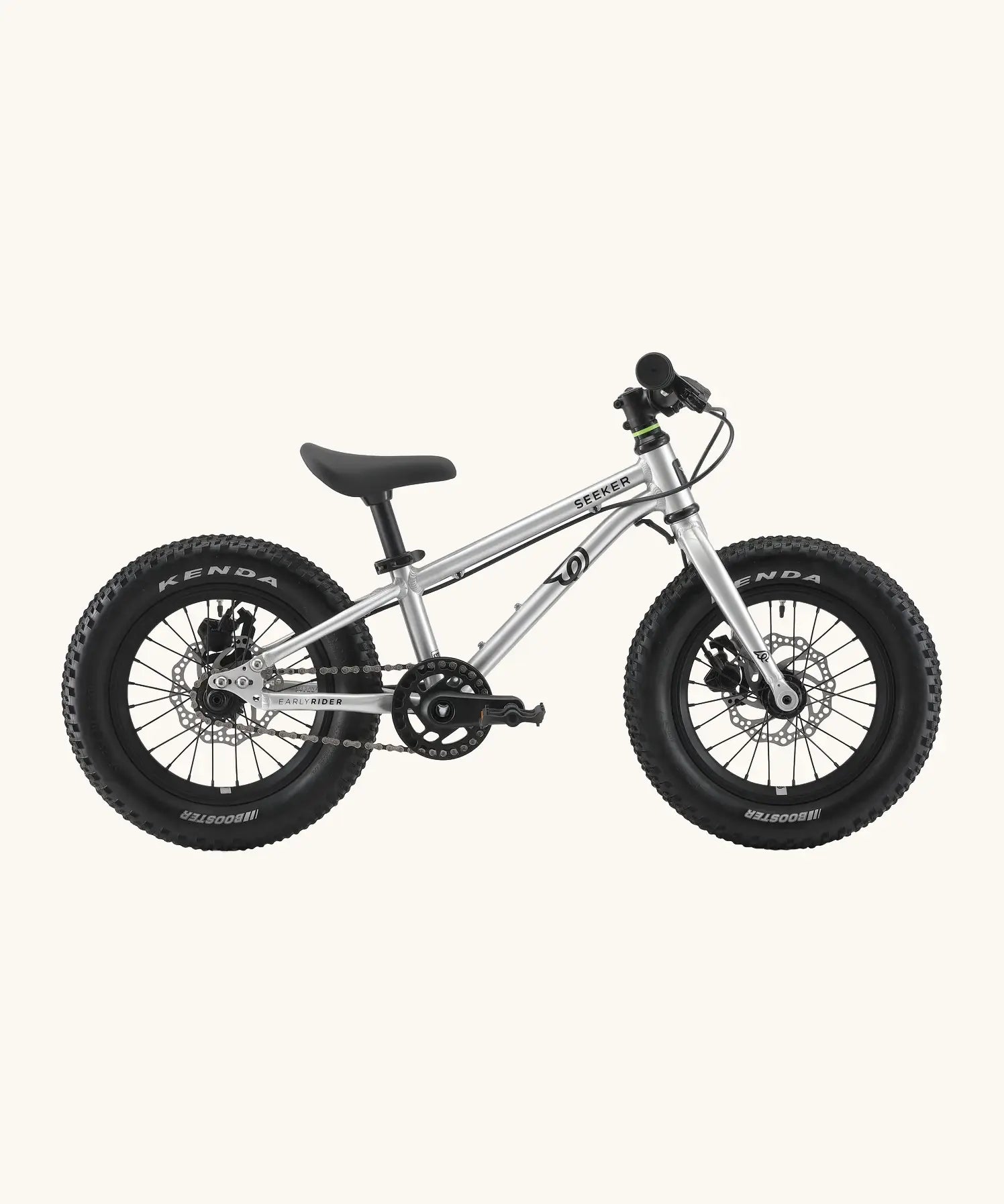 Side of Early Rider kids Seeker 14 inch mountain bike in brushed alloy. Features disk brakes and chunky wheels