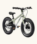 Early Rider kids Seeker 14 inch mountain bike in sage green with a brushed aluminium bottom half. Features disk brakes and chunky wheels