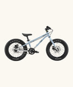Side of Early Rider kids Seeker 16 inch mountain bike in arctic blue with a brushed aluminium bottom half frame. Features disk brakes and chunky wheels
