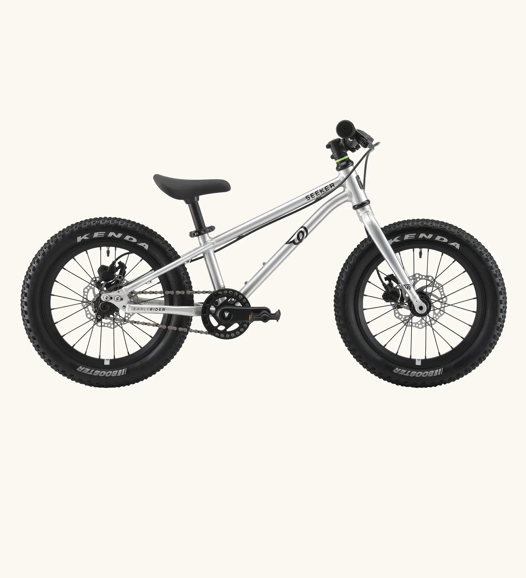 Side of Early Rider kids Seeker 14 inch mountain bike in brushed alloy. Features disk brakes and chunky wheels