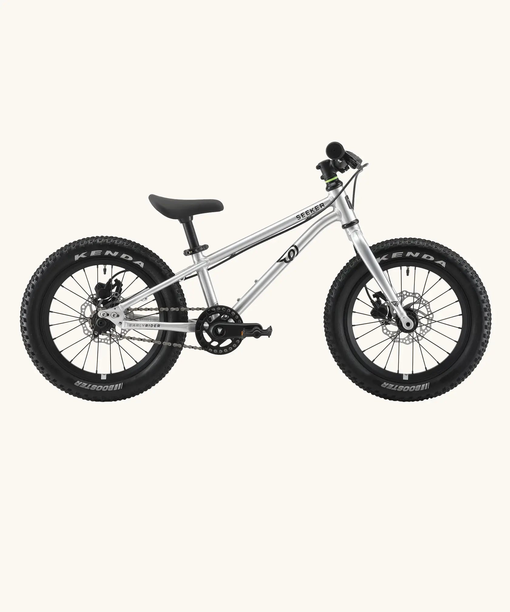Side of Early Rider kids Seeker 14 inch mountain bike in brushed alloy. Features disk brakes and chunky wheels