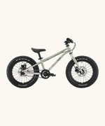 Side of Early Rider kids Seeker 16 inch mountain bike in sage green with a brushed aluminium bottom half frame. Features disk brakes and chunky wheels