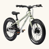 Early Rider kids Seeker 16 inch mountain bike in sage green with a brushed aluminium bottom half. Features disk brakes and chunky wheels