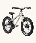 Early Rider kids Seeker 16 inch mountain bike in sage green with a brushed aluminium bottom half. Features disk brakes and chunky wheels