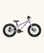 Side of Early Rider kids Seeker 16 inch mountain bike in violet haze with a brushed aluminium bottom half frame. Features disk brakes and chunky wheels