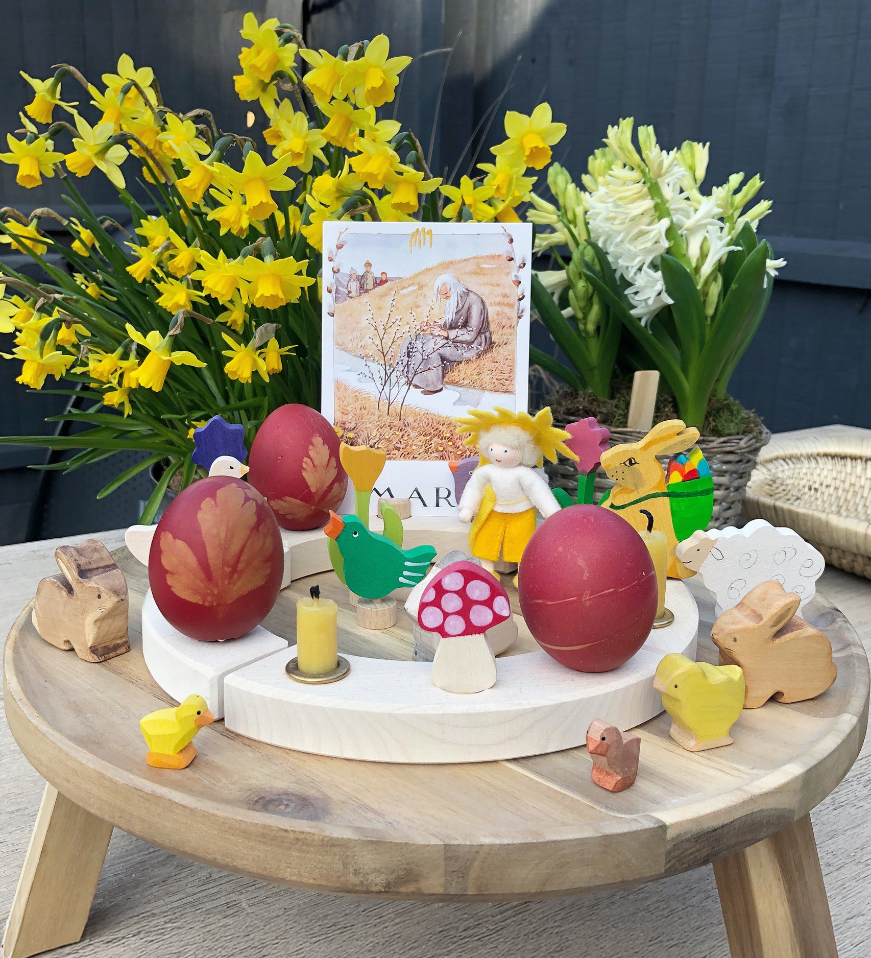 Eggs dyed using teh Okonorm egg dye kit shown on a celebration ring display with Easter and Spring themed toys and decorations. 