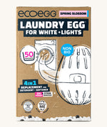 Eco-egg laundry egg for whites & lights in spring blossom fragrance. Showing the product in a sketch style with branding on the brown recycled cardboard box