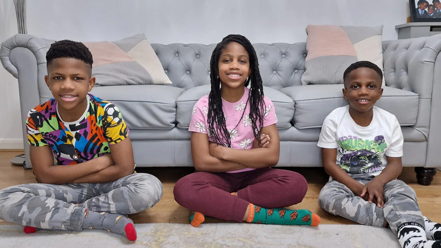 Eco Kiddies' young and inspiring founders - Francis, Claire, and Emmanuel design organic cotton socks for kids