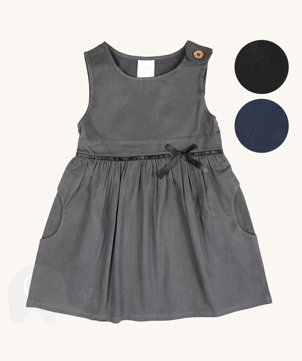 The Eco Outfitters organic and fair trade cotton school pinafore dress in grey with a bow detail, along with other colour swatches.