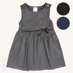 The Eco Outfitters organic and fair trade cotton school pinafore dress in grey with a bow detail, along with other colour swatches.