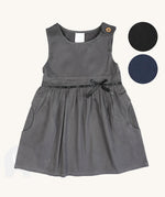 The Eco Outfitters organic and fair trade cotton school pinafore dress in grey with a bow detail, along with other colour swatches.