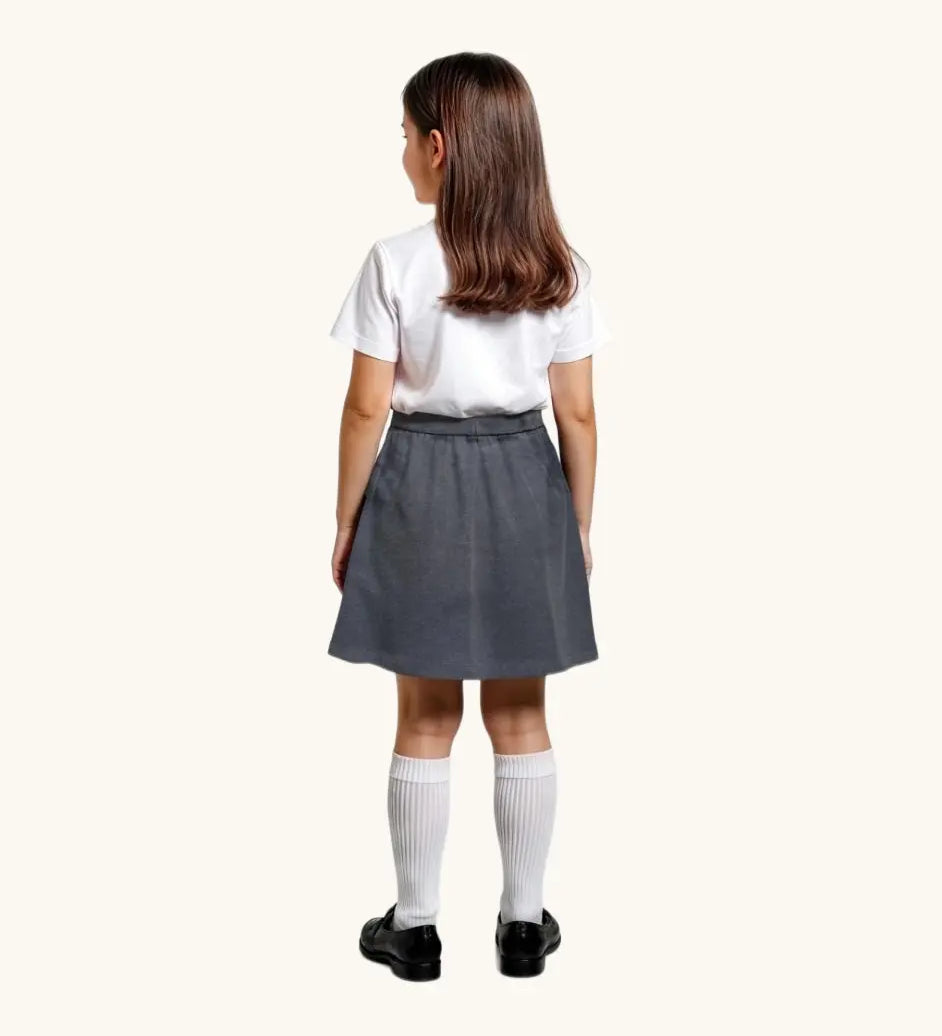 Eco Outfitters grey school jersey skirt being worn with a white polo shirt. View of the back.