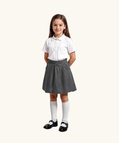 Eco Outfitters grey school jersey skirt being worn with a white polo shirt.