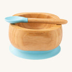 Bamboo baby weaning bowl and spoon with blue silicone tip and suction pad.