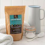 Ecoliving Natural Earth Bleach Percarbonate of Soda pictured next to glass jar and metal jug