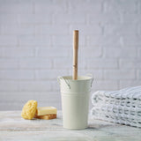 Ecoliving Small Wooden Toilet Brush pictured in a cream metal holder