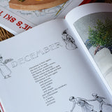 Around The Year children's hardback book by Elsa Beskow show open on the December page.