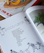 Around The Year children's hardback book by Elsa Beskow show open on the December page.