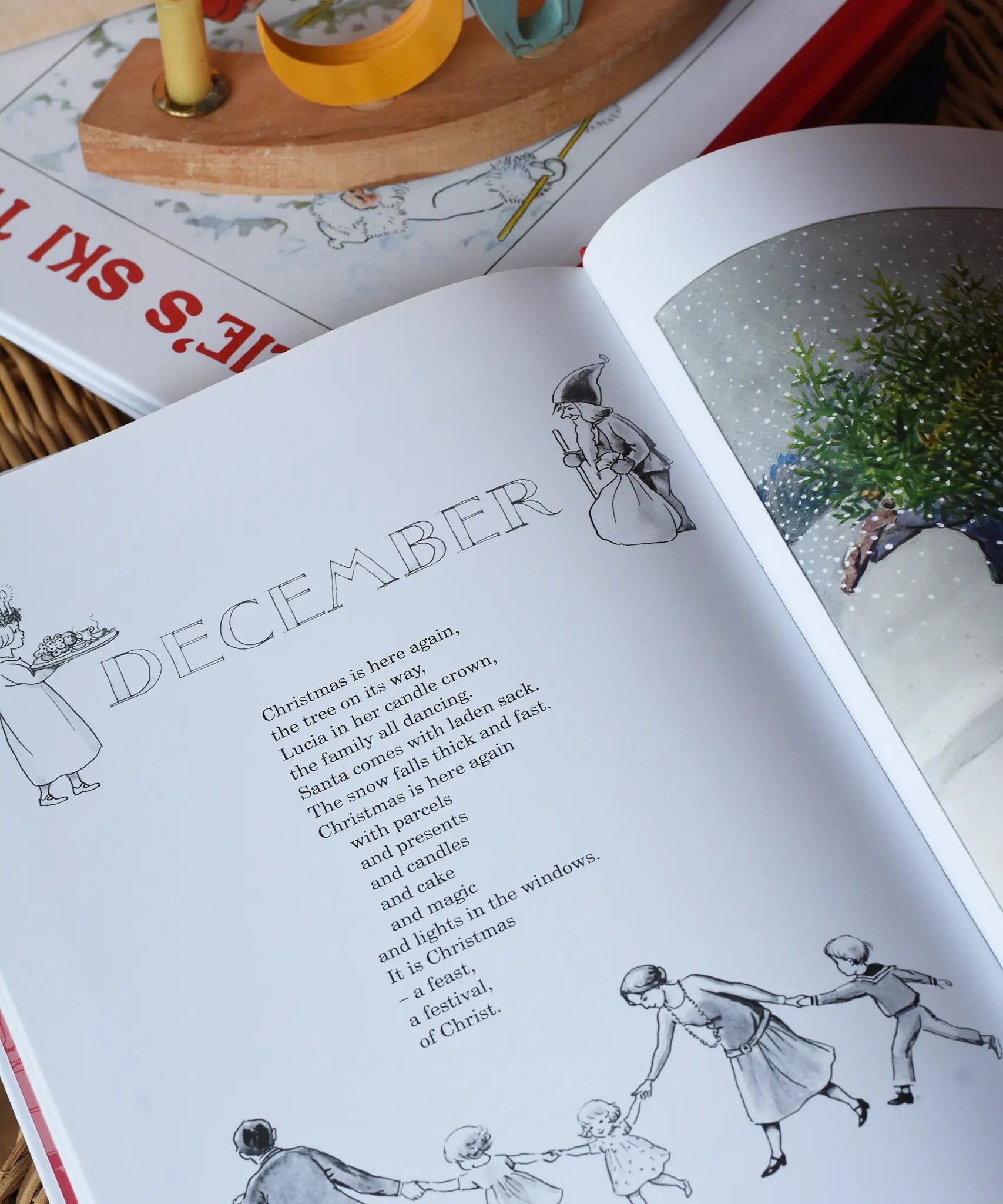 Around The Year children's hardback book by Elsa Beskow show open on the December page.
