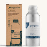 A bottle of the Georganics english peppermint oil pulling mouthwash with the box