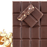 almond chocolate broken into pieces with almonds next to it