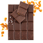 Bar of caramel chocolate broken into pieces with bits of carmel around