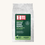 Equal Exchange decaf dark roast ground coffee in a white 200g bag.