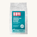 Equal Exchange Grown by Women organic ground coffee in a white bag.