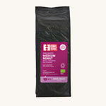 Equal Exchange organic and fairtrade medium roast coffee beans in a black 1kg bag.
